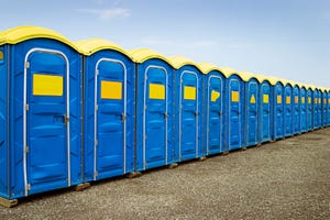 a row of blue and yellow toilets