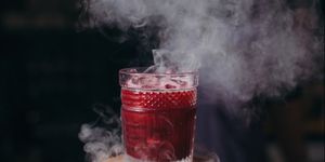 Barman preparing a smoky cocktail