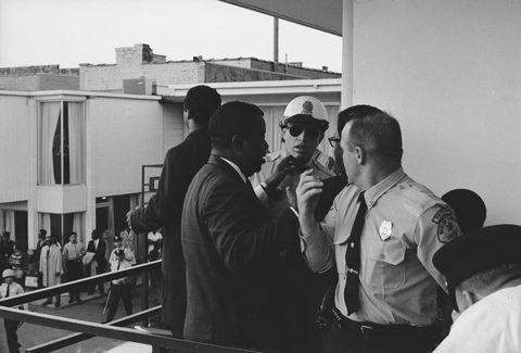 Police officers stand at the scene after the assassination of Martin Luther King Jr. at the Lorraine Motel in Memphis, Tennessee, on April 4, 1968.