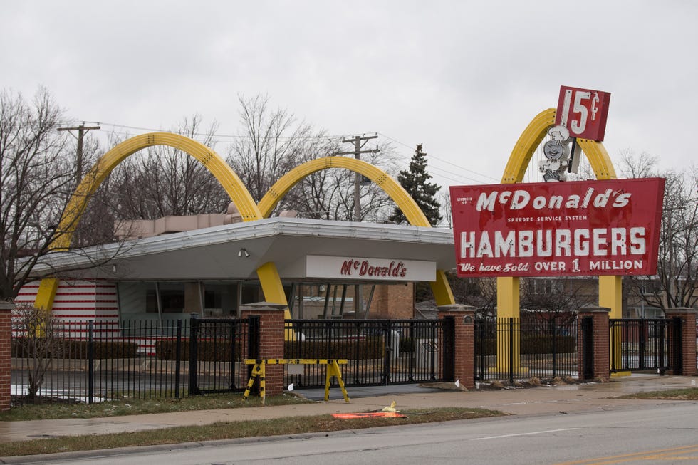 Architecture, Yellow, Building, Urban area, Real estate, Tree, City, Fast food restaurant, Mixed-use, Restaurant,