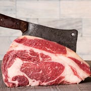 Prime rib Meat raw prime rib beef with meat cleaver