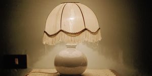 A lamp on a side table