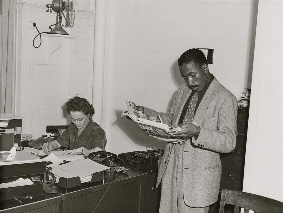 united states   circa 1943  gordon parks, farm security administrationoffice of war information photographer, standing in office with helen wool seated at desk  photo by buyenlargegetty images