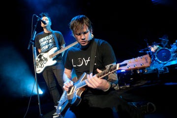 columbia, md august 30 lead singer tom delonge and bassist mark hoppus l of blink 182 perform at the virgin mobile freefest on august 30, 2009 in columbia, maryland the music festival gave away all 35,000 tickets for free photo by brendan hoffmangetty images