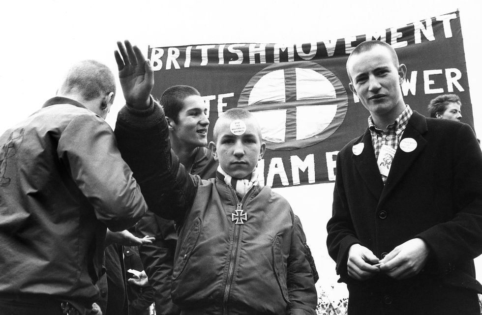 UK, October 25, skinhead with a sticker on his forehead “stop this multiracial madness” banner of the British movement for supporters of “white power” photo: ssplgetty images