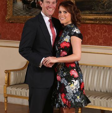 britains princess eugenie of york r poses with her fiance jack brooksbank in the picture gallery at buckingham palace in london on january 22, 2018, after the announcement of their engagement britains princess eugenie of york wears a dress by erdem, shoes by jimmy choo and a ring containing a padparadscha sapphire surrounded by diamonds britains princess eugenie of york has got engaged, buckingham palace announced january 22, 2018, lining up a second royal wedding this year at the church where prince harry will tie the knot photo by jonathan brady pool afp photo credit should read jonathan bradyafp via getty images