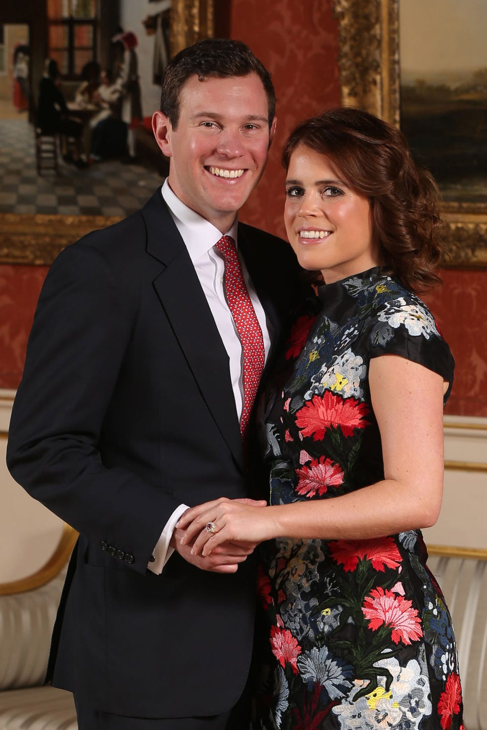 london, england january 22 editors note alternative crop of image 908732602 princess eugenie and jack brooksbank pose in the picture gallery at buckingham palace after they announced their engagement princess eugenie wears a dress by erdem, shoes by jimmy choo and a ring containing a padparadscha sapphire surrounded by diamonds on january 22, 2018 in london, england they are to marry at st georges chapel in windsor castle in the autumn this year photo by jonathan brady wpa poolgetty images
