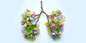 flowers, leaves, and tree branch in the shape of lungs