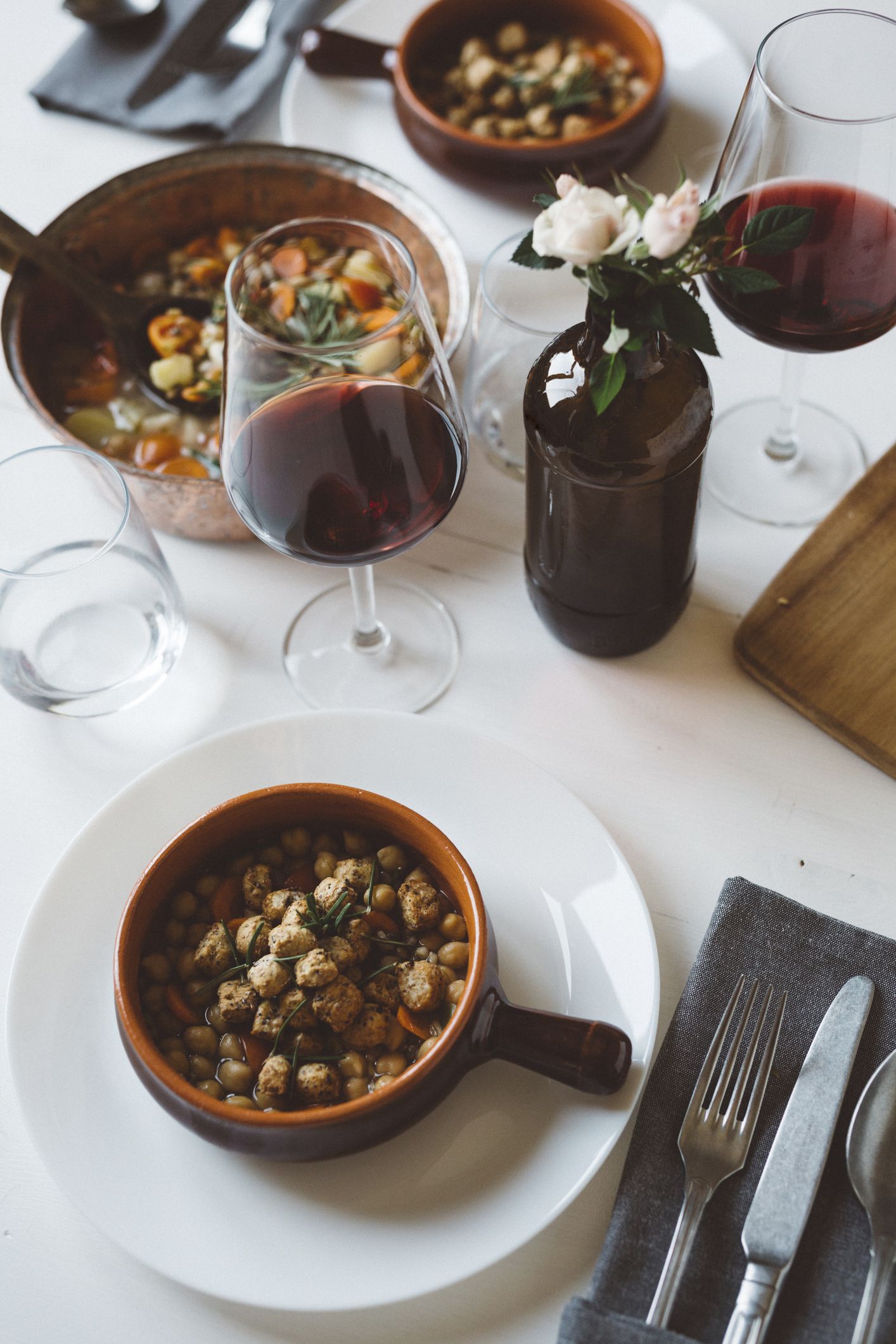 Laid table with Mediterranean soup and red wine