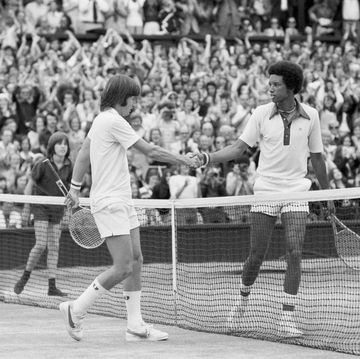 jimmy connors left shakes hands with arthur ashe after his defeat in the final which he lost in four sets 6 1, 6 1, 5 7, 6 4, 6th july 1975 photo by staffmirrorpixgetty images