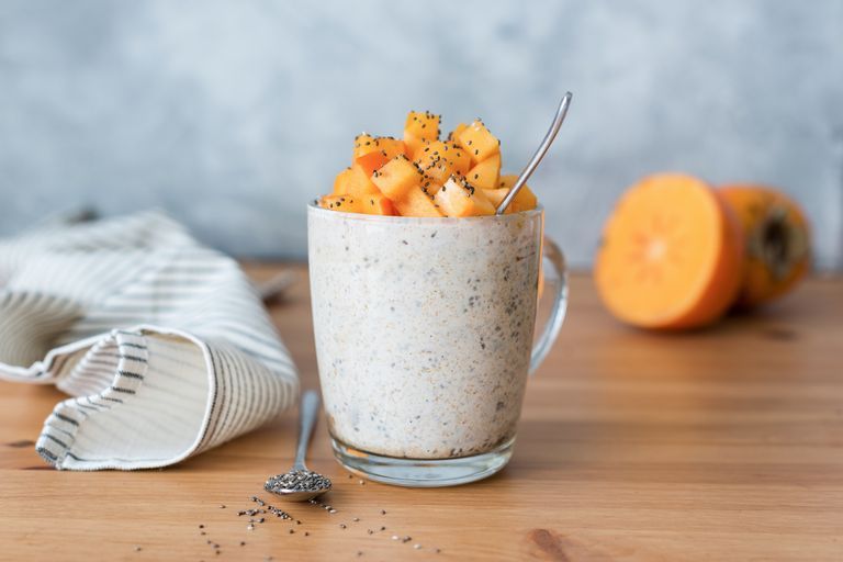 weight loss breakfast chia seed pudding with persimmon in glass concept of healthy lifestyle, healthy eating, dieting, weight loss and balanced meal diet