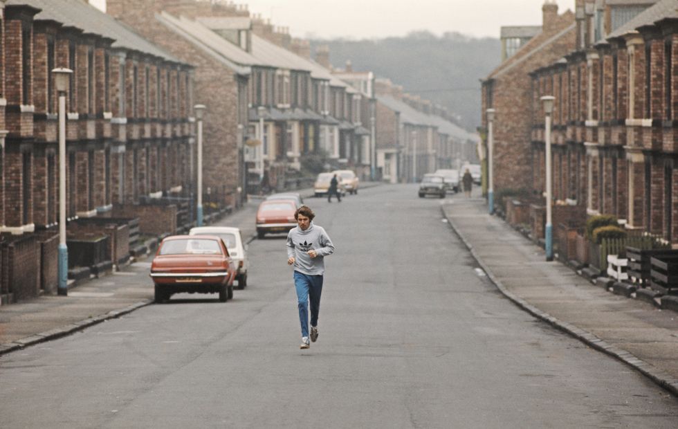 gateshead, united kingdom   october 01  track athlete brendan foster pictured running through a terraced street during a training run circa 1977 in gateshead, england  photo by tony duffyallsportgetty images