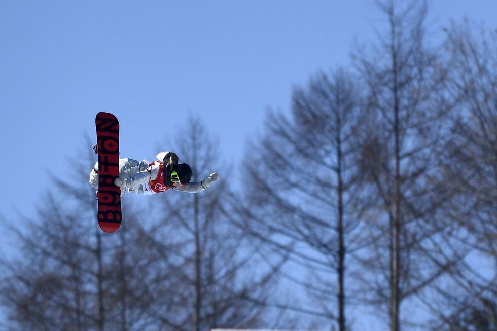 Snow, Winter, Slopestyle, Snowboarding, Extreme sport, Sky, Tree, Freestyle skiing, Vehicle, Flip (acrobatic), 