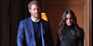 edinburgh, scotland   february 13  prince harry and meghan markle walk through the corridors of the palace of holyroodhouse on their way to a reception for young people at the palace on february 13, 2018 in edinburgh, scotland  photo by andrew milligan   wpa poolgetty images