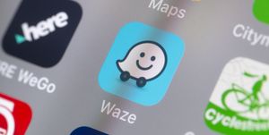 The buttons of the App 'Waze' and other travel Apps on a cellphone screen