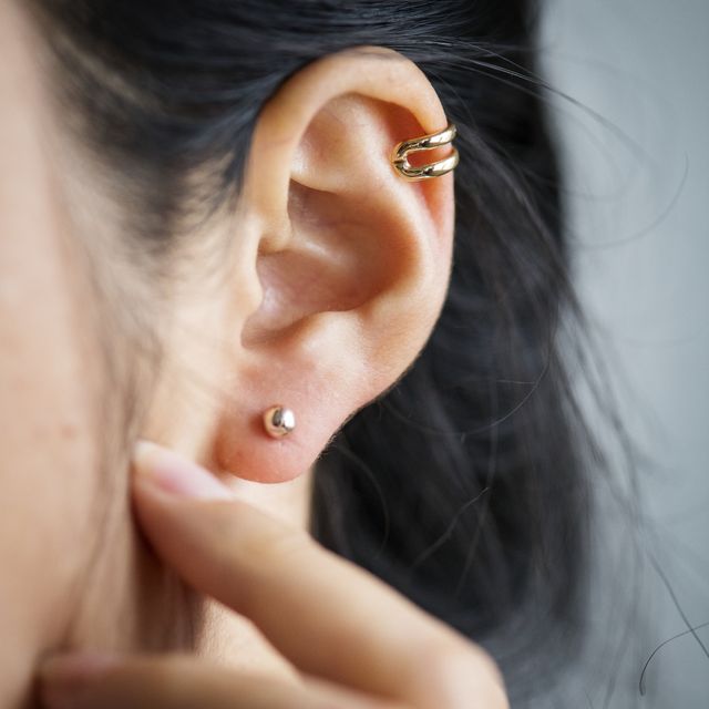 Close up of woman's ear with earrings
