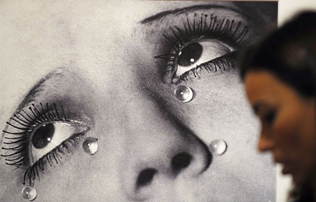 a visitor looks at the photo tears by man ray 1932 during the opening of the exhibition tears of eros at the thyssen bornemisza museum in madrid, on october 19, 2009  afp photodominique faget photo credit should read dominique fagetafp via getty images
