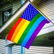 rainbow banner, displayed in in support of the lgbt lgbtq rights on a  house in columbus oh