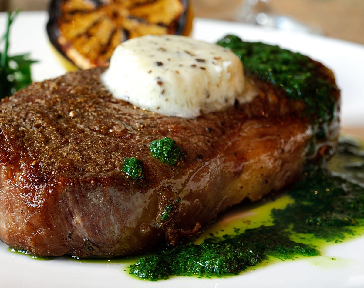 fillet mignon with green herbal sauce and butter