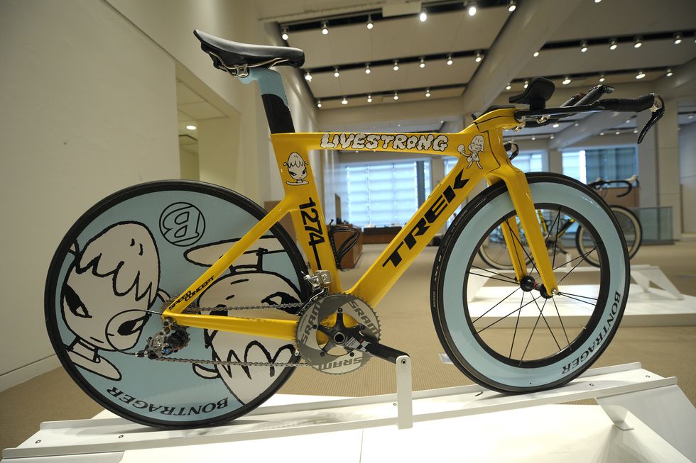 a trek speed concept bicycle, decorated by japanese modern art artist yoshitomo nara for champion cyclist lance armstrong, is on display at "its' about the bike" exhibition and auction preview at sotheby's in new york, october 27, 2009 "it's about the bike" is an exhibition which features the seven bikes ridden by armstrong in his 2009 comeback season the bikes, decorated by world renowned artists, will be sold at a private auction on november 01, 2009, with all proceeds going to "livestrong", lance armstrong's cancer foundation       afp photoemmanuel dunand photo credit should read emmanuel dunandafp via getty images