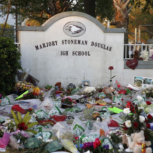 flowers, candles and mementos sit outside one of the makeshift memorials at marjory stoneman douglas high school in parkland, florida on february 27, 2018
floridas marjory stoneman douglas high school will reopen on february 28, 2018 two weeks after 17 people were killed in a shooting by former student, nikolas cruz, leaving 17 people dead and 15 injured on february 14, 2018  afp photo  rhona wise        photo credit should read rhona wiseafp via getty images