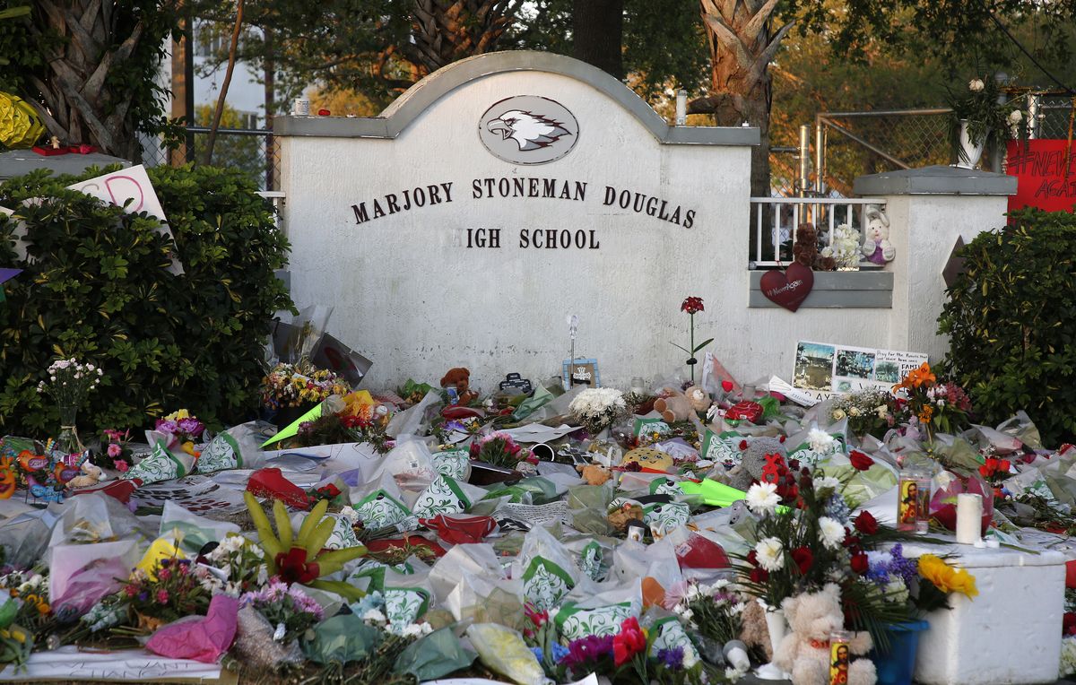 flowers, candles and mementos sit outside one of the makeshift memorials at marjory stoneman douglas high school in parkland, florida on february 27, 2018
floridas marjory stoneman douglas high school will reopen on february 28, 2018 two weeks after 17 people were killed in a shooting by former student, nikolas cruz, leaving 17 people dead and 15 injured on february 14, 2018  afp photo  rhona wise        photo credit should read rhona wiseafp via getty images