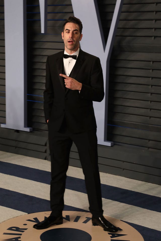 Suit, Formal wear, Standing, Tuxedo, Fashion, White-collar worker, Human, Design, Outerwear, Dress shirt, 