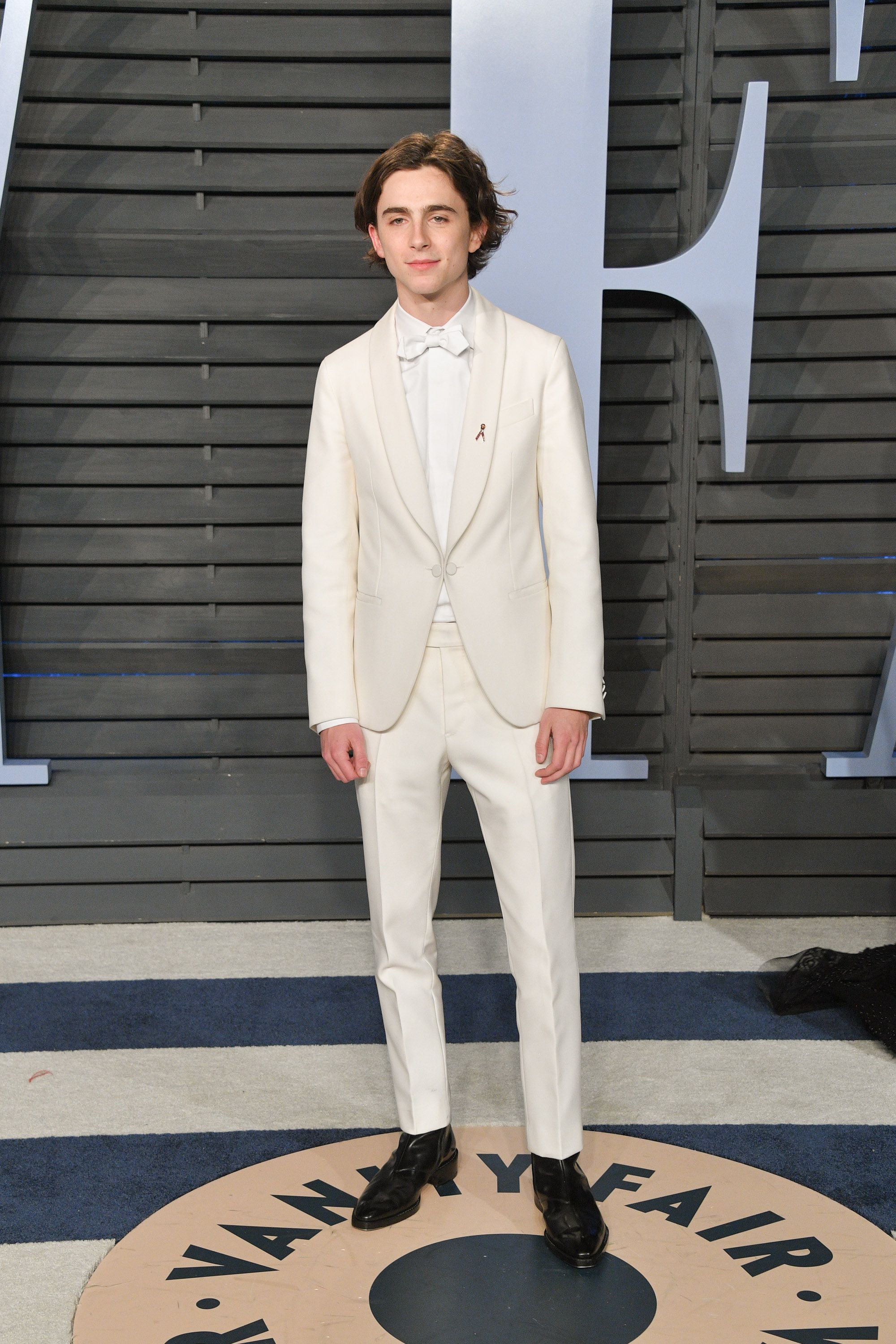 white suit with black shoes