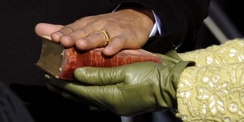 barack obamas hand lies on a bible as he is sworn in as the 44th us president by supreme court chief justice john roberts in front of the capitol in washington on january 20, 2009       afp photo timothy a clary photo credit should read timothy a claryafp via getty images