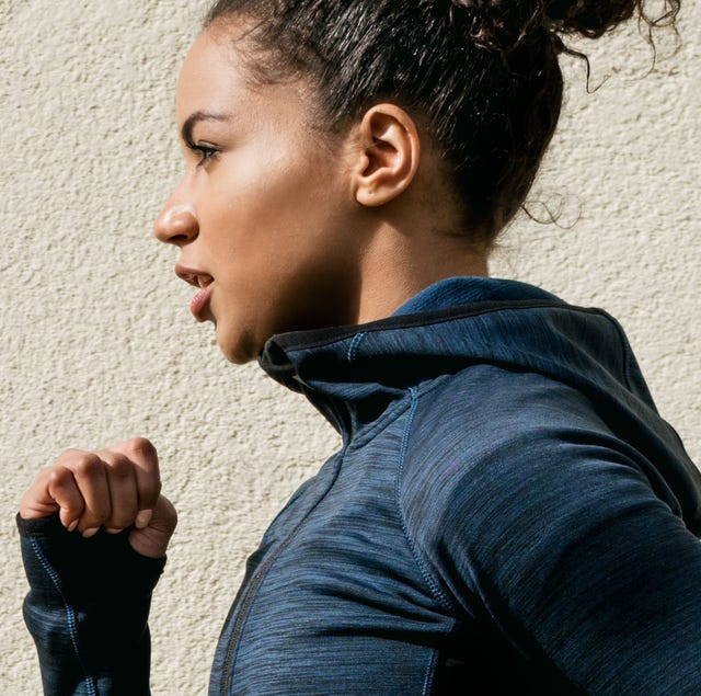 Woman Running Against Wall Woman Running Against Wall