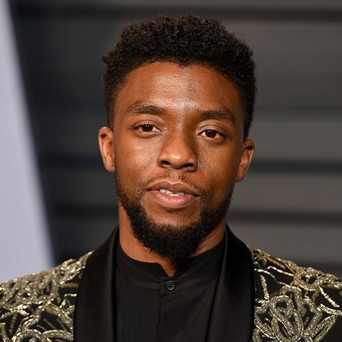 chadwick boseman in black and gold suit
