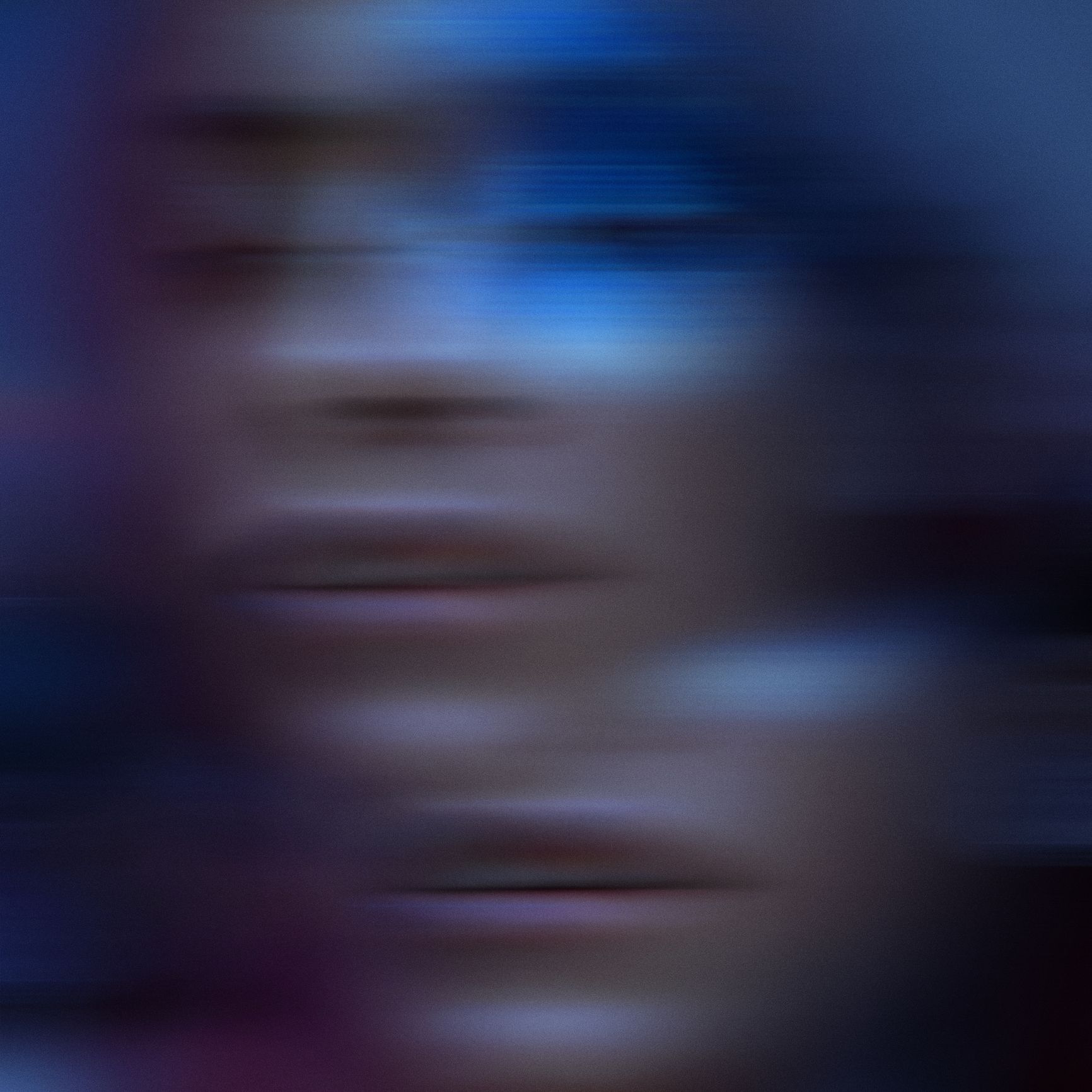 Blured motion portrait of female face in ultraviolet tones