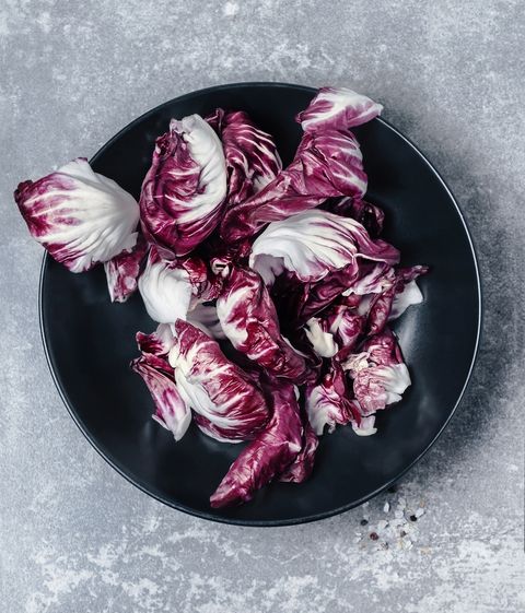 radicchio leaves on a plate on gray background