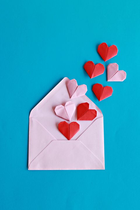 Red and pink paper hearts on the pink envelope