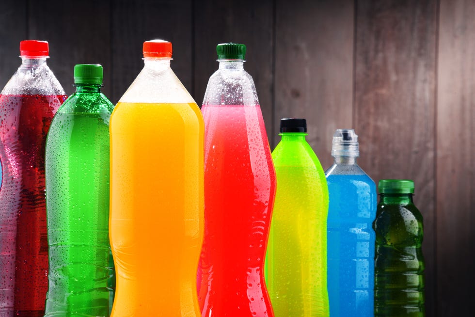 plastic bottles of assorted carbonated soft drinks in variety of colors