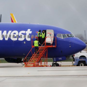 A Southwest Airlines jet sits on the runway at Philadelphia International Airport after it was forced to land with an engine failure, in Philadelphia, Pennsylvania, on April 17, 2018. 