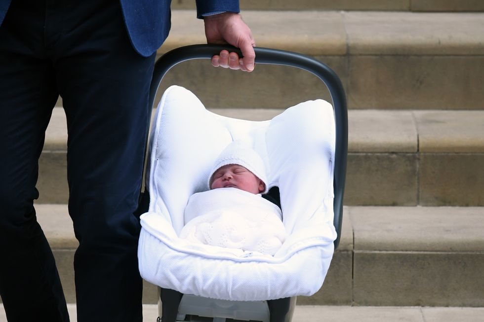 Newborn prince carried by Prince William