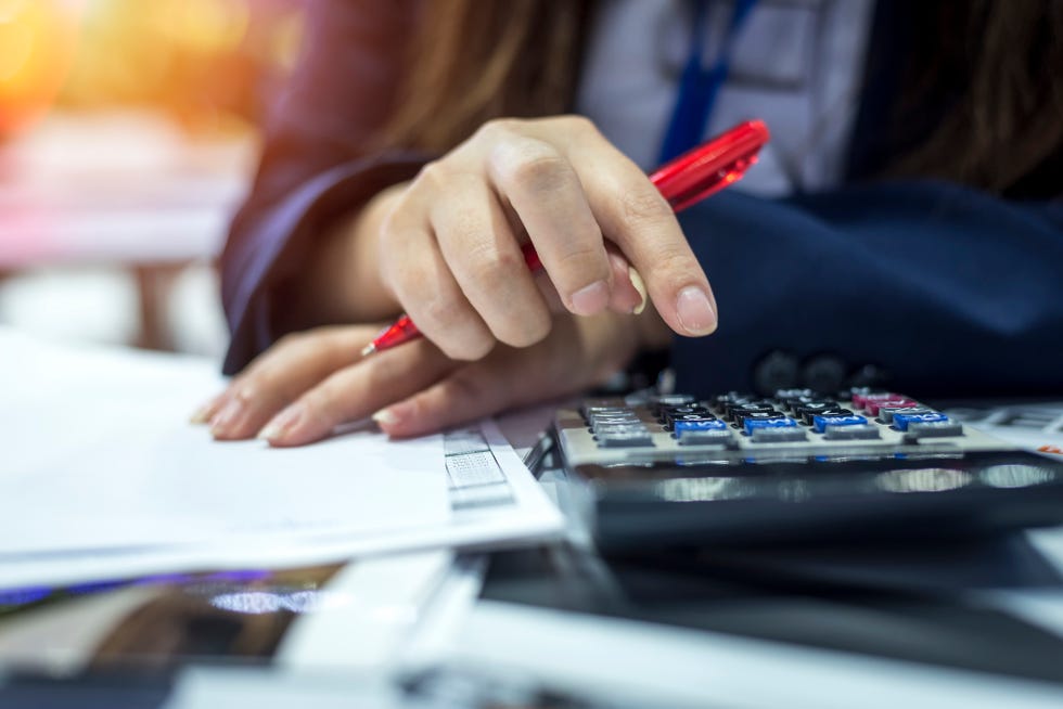 hands of bank officer calculating loans