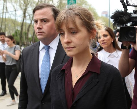 brooklyn, ny   may 04  actress allison mack r departs the united states eastern district court after a bail hearing in relation to the sex trafficking charges filed against her on may 4, 2018 in the brooklyn borough of new york city the actress known for her role on smallville is charged with sex trafficking along with alleged cult leader keith raniere, prosecutors say mack recruited women to a upstate new york mentorship group nxivm that turned them into sex slaves  photo by jemal countessgetty images
