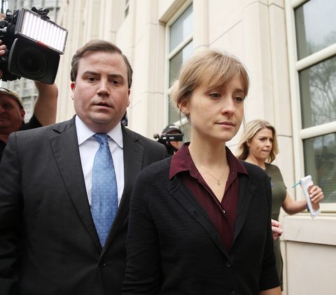 new york, ny may 04 actress allison mack r departs the united states eastern district court after a bail hearing in relation to the sex trafficking charges filed against her on may 4, 2018 in the brooklyn borough of new york city the actress known for her role on smallville is charged with sex trafficking along with alleged cult leader keith raniere, prosecutors say mack recruited women to an upstate new york mentorship group nxivm that turned them into sex slaves photo by jemal countessgetty images