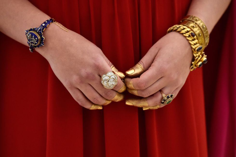 Nail, Red, Yellow, Hand, Finger, Jewellery, Interaction, Fashion accessory, Gesture, Gold, 