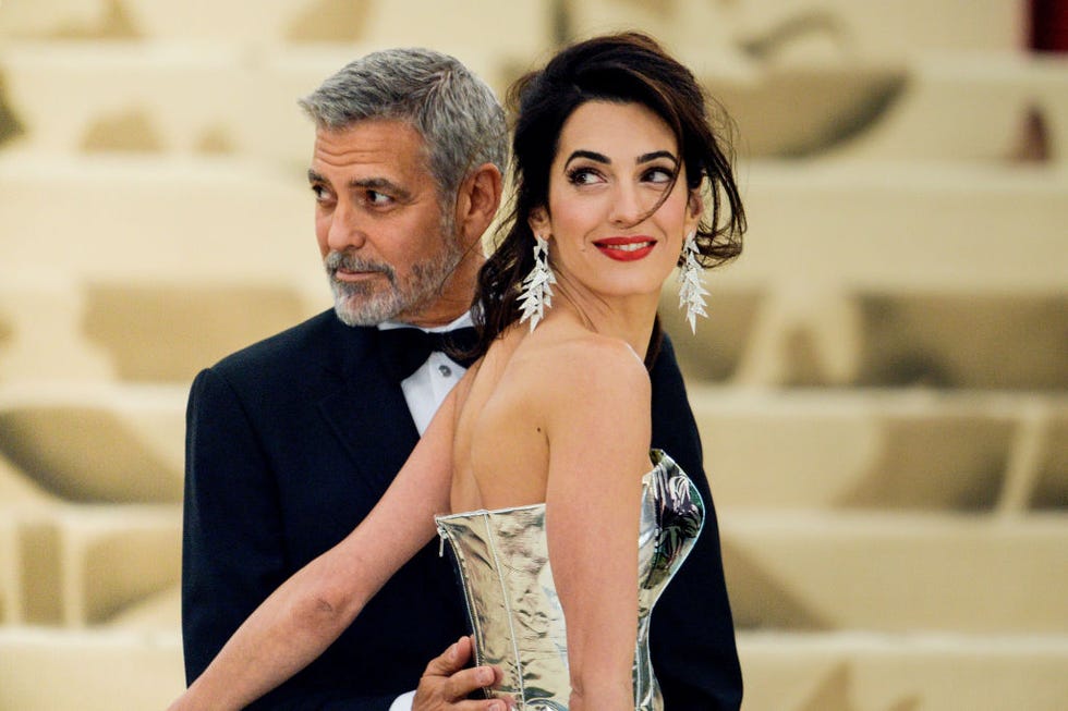new york, ny may 07: actor george clooney (l) and lawyer amal clooney enter the heavenly bodies: fashion  the catholic imagination costume institute gala at the metropolitan museum on may 07, 2018 in new york city. (photo by ray tamarra/gc images)