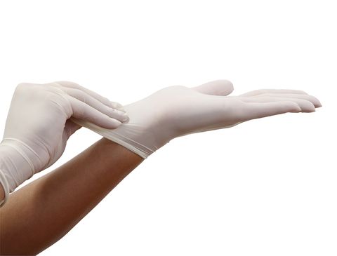 Cropped Hand Of Person Wearing Surgical Glove Against White Background