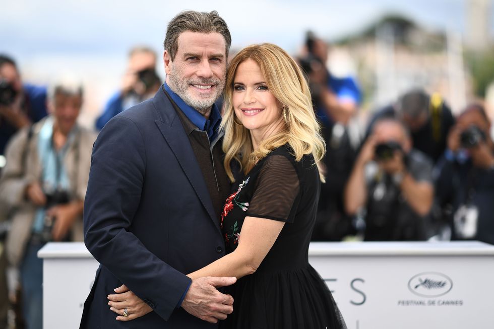 topshot   us actor john travolta l and his wife us actress kelly preston pose on may 15, 2018 during a photocall for the film gotti at the 71st edition of the cannes film festival in cannes, southern france photo by anne christine poujoulat  afp        photo credit should read anne christine poujoulatafp via getty images