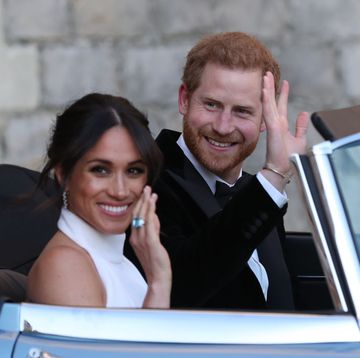 windsor, united kingdom may 19 duchess of sussex and prince harry, duke of sussex wave as they leave windsor castle after their wedding to attend an evening reception at frogmore house, hosted by the prince of wales on may 19, 2018 in windsor, england photo by steve parsons wpa poolgetty images