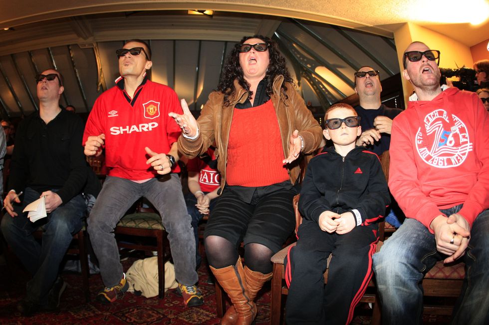 manchester, england   january 31 manchester united football fans in manchester watch the worlds first live 3d tv football match between arsenal and manchester united broadcast by sky ahead of its full 3d channel launch in april,, on january 31, 2010 in manchester, england photo by getty images for sky