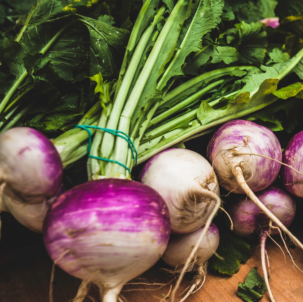 Turnips on a market stall in Ponte de Lima healthy bunches of fresh turnips on the table in the monthly farmers market in ponte de lima, portugal