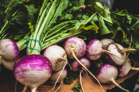 healthy bunches of fresh turnips on the table in the monthly farmers market in ponte de lima, portugal