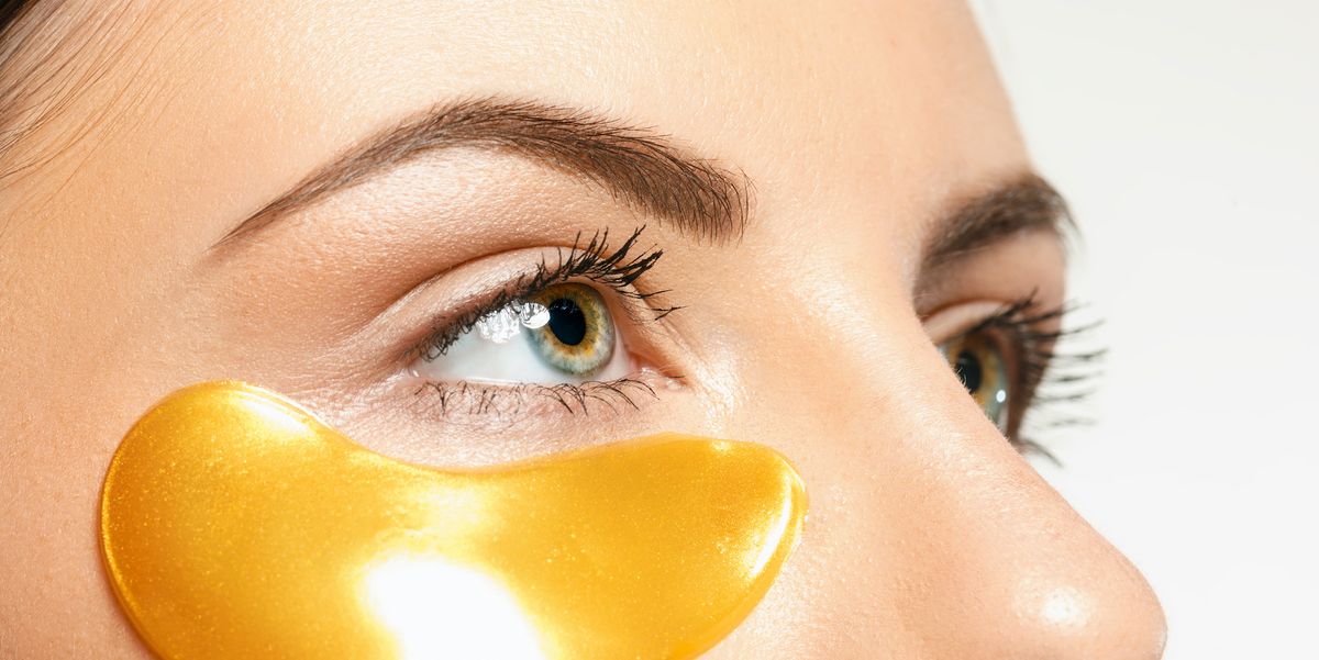 beauty portrait of an attractive girl with a gold patch under the eyes spa treatment and face beauty concept female face care and perfect skin concepts