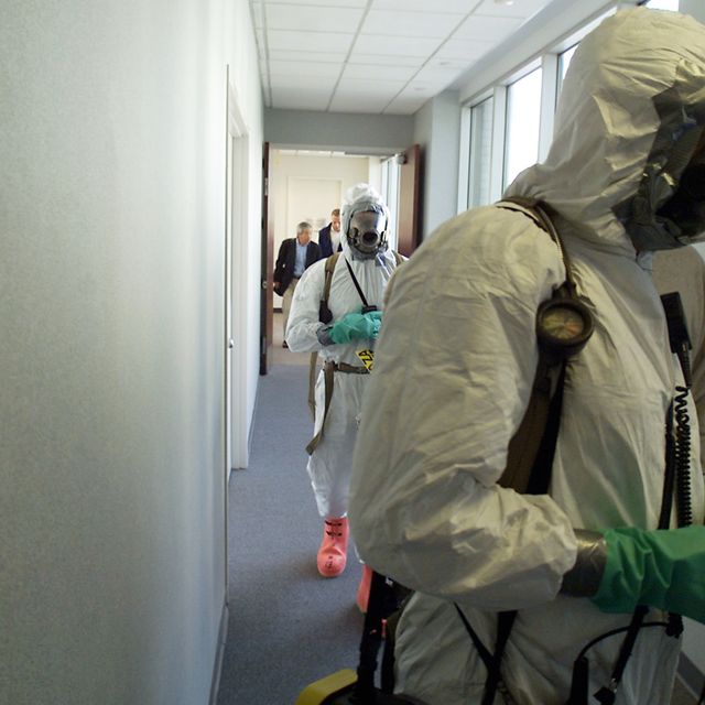FIrefighters in Hazmat gear respond to a suspected white powder incident in 2001.